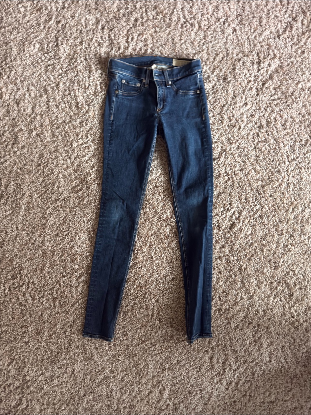 rag & bone dark indigo jeans with brown stitching